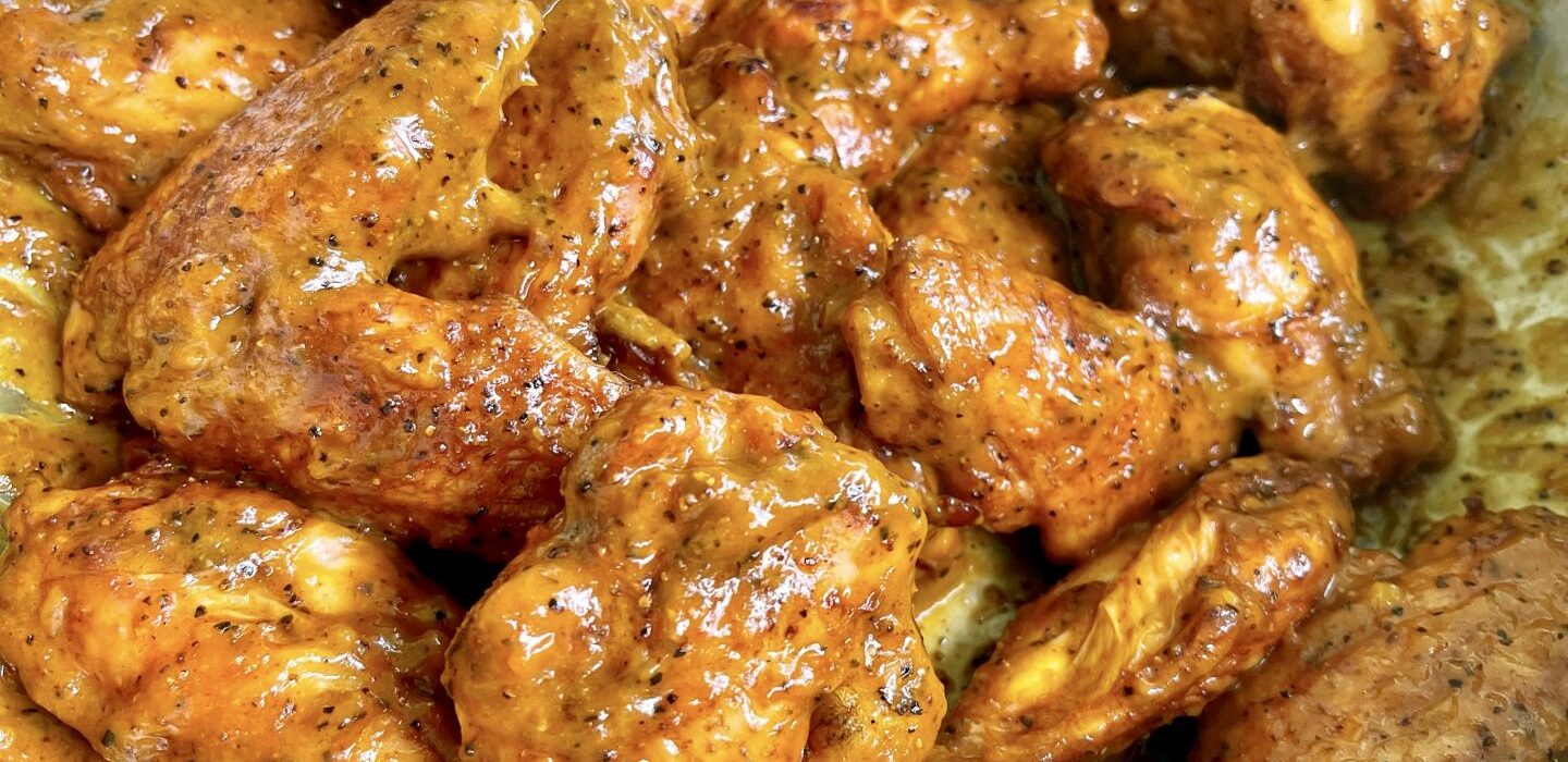 sauced chicken wings in a bowl