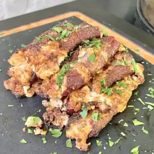 JalapeƱo popper pinwheels on a cutting board