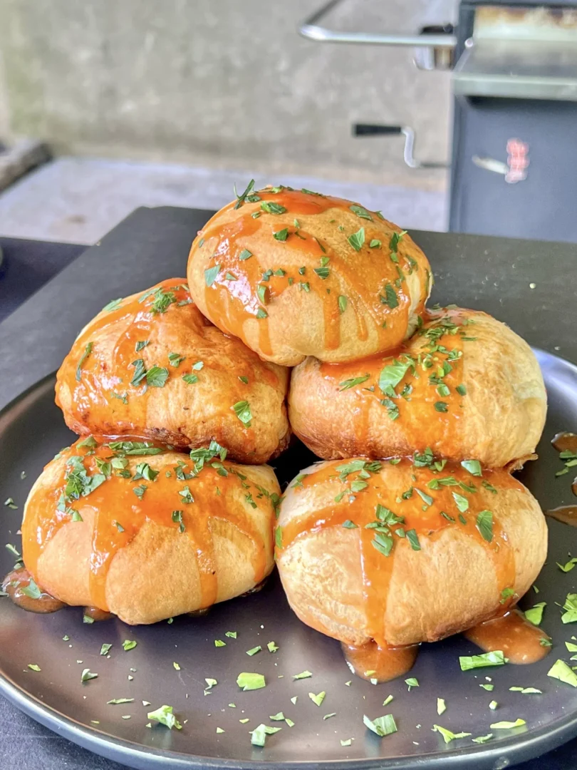 buffalo chicken bites with sauce on them