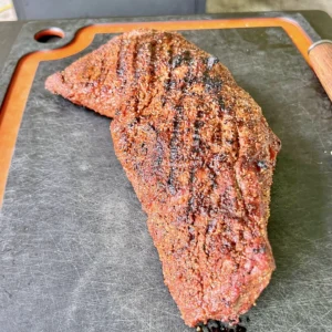 smoking tri-tip sandwich on. cutting board