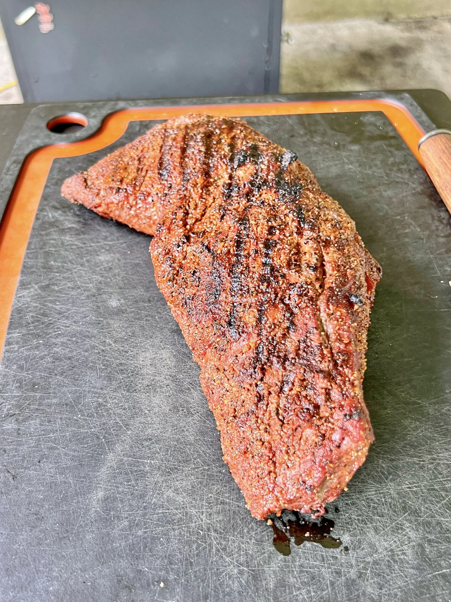 smoking tri-tip sandwich on. cutting board