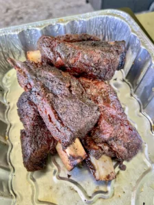 smoked beef short ribs on the grill
