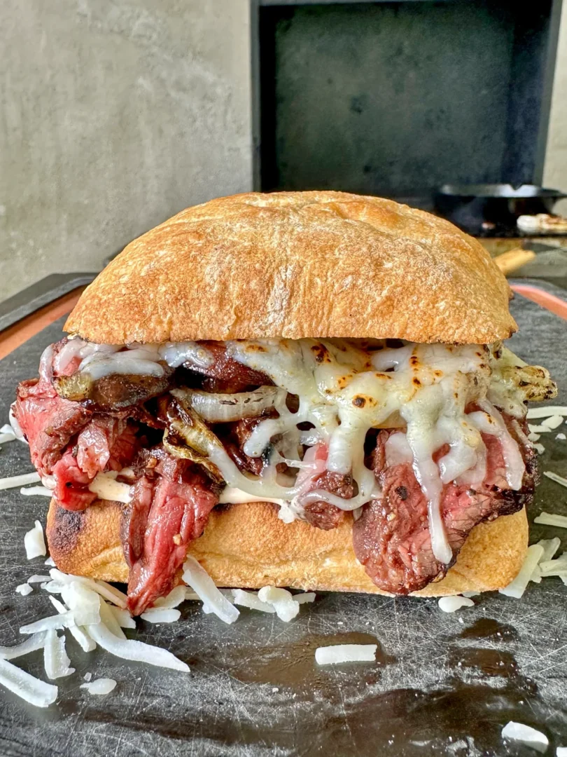 hanger steak sandwich on a cutting board