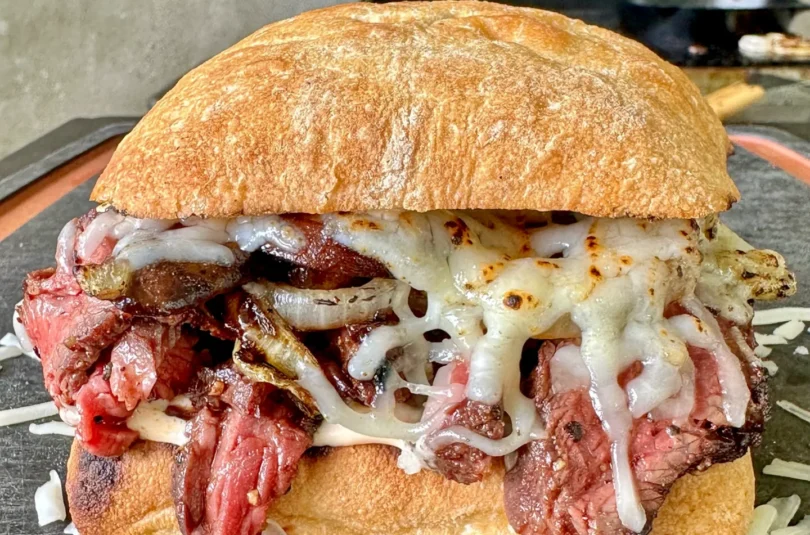 hanger steak sandwich on a cutting board
