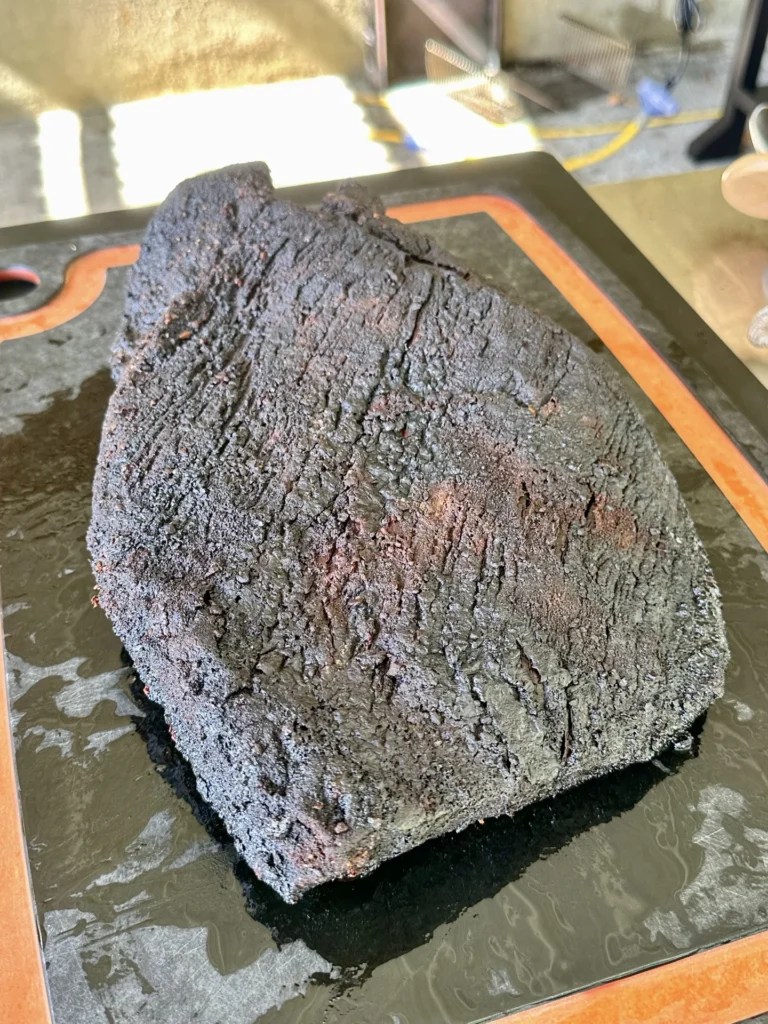 smoked brisket on a cutting board