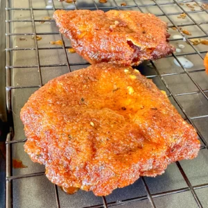 fried pork chop on a resting rack