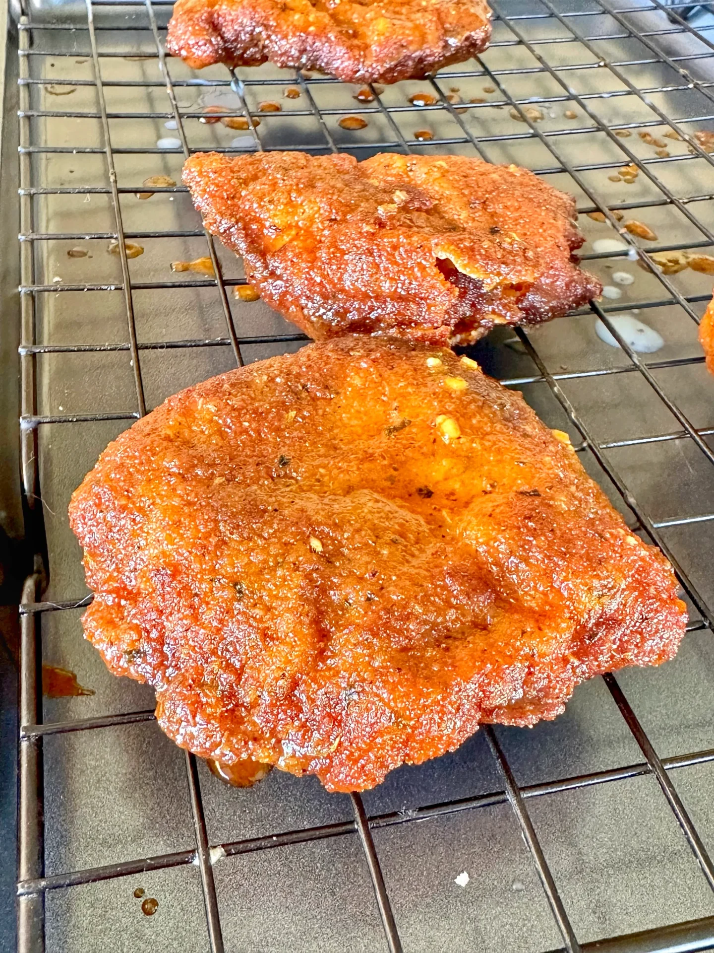 fried pork chop on a resting rack