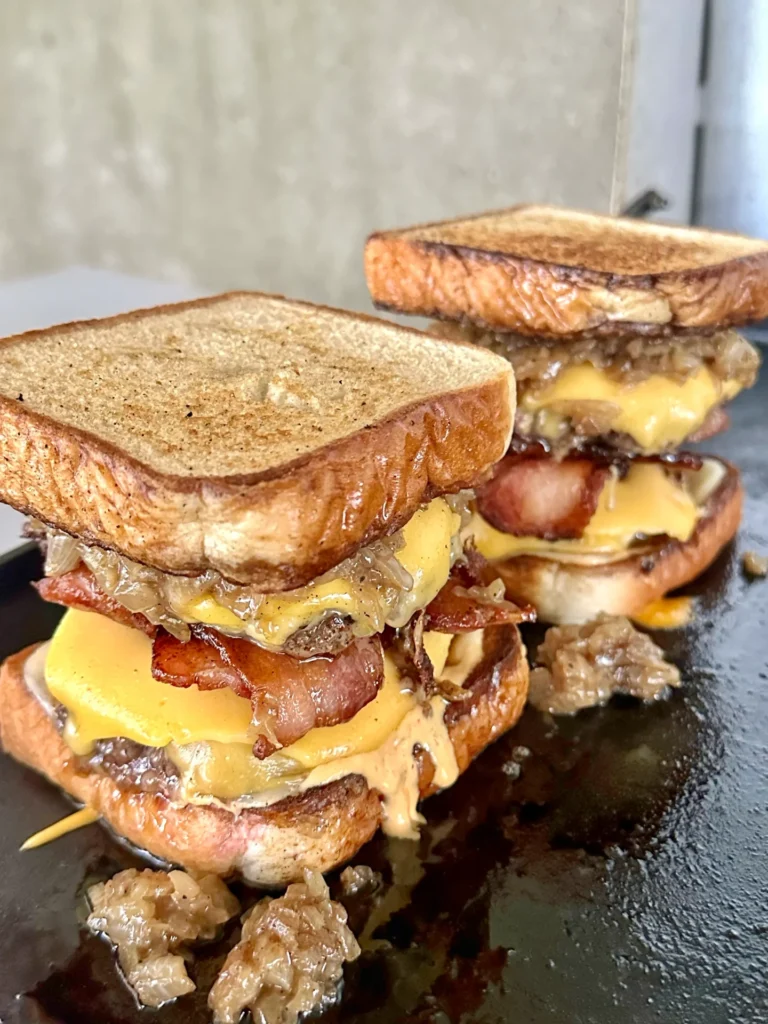 both patty melts on a griddle