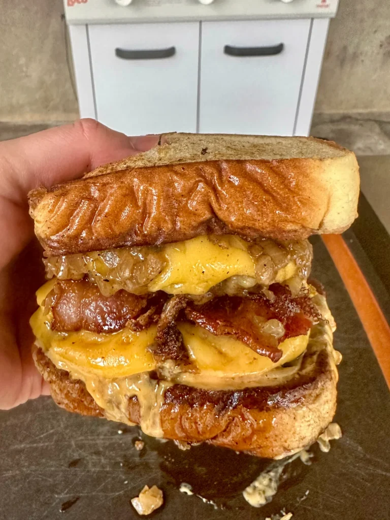 patty melt in a hand