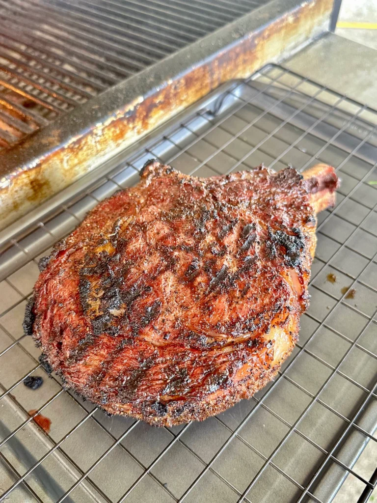 seared steak on a resting rack