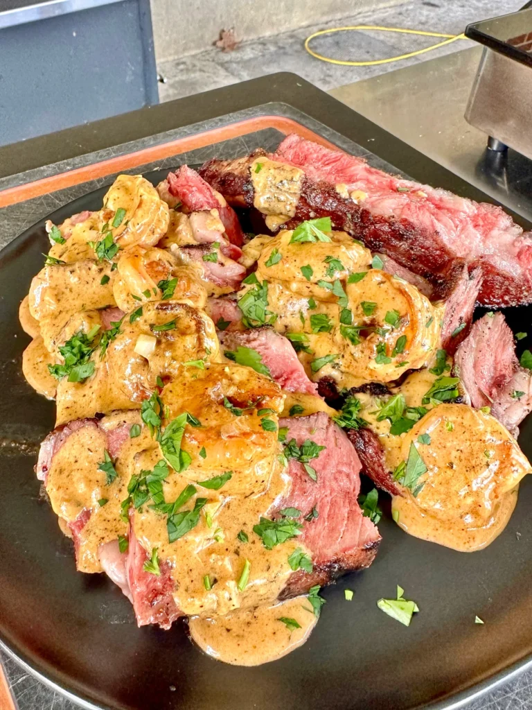 shrimp sauce on a cut ribeye
