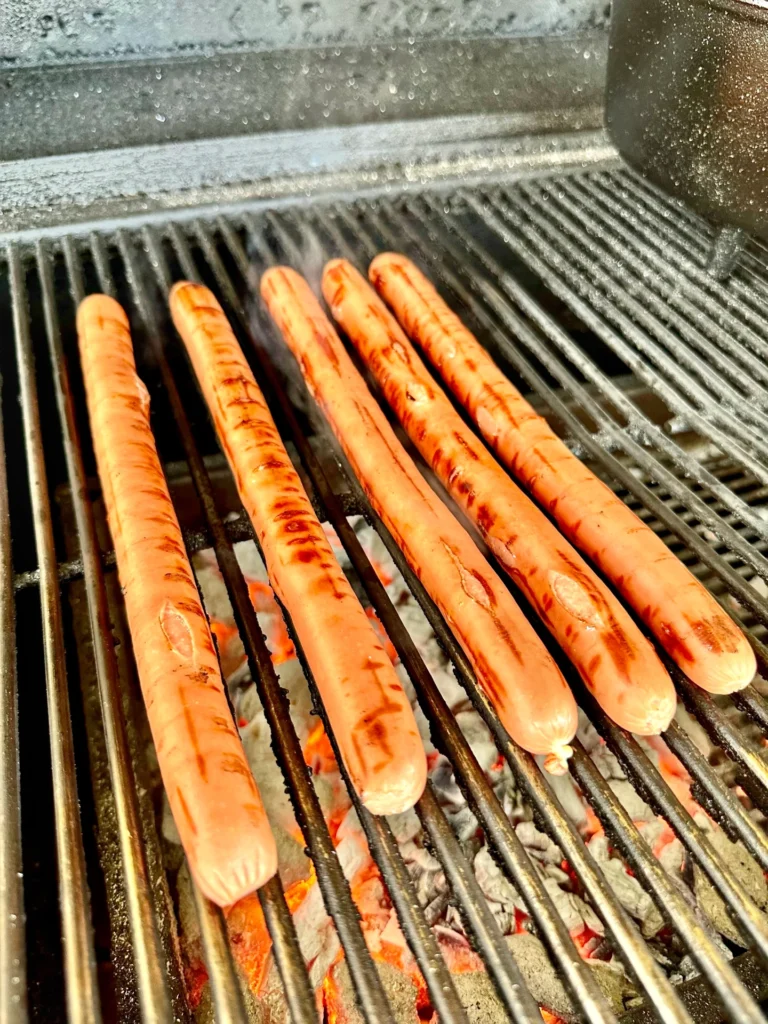 hot dogs on the grill