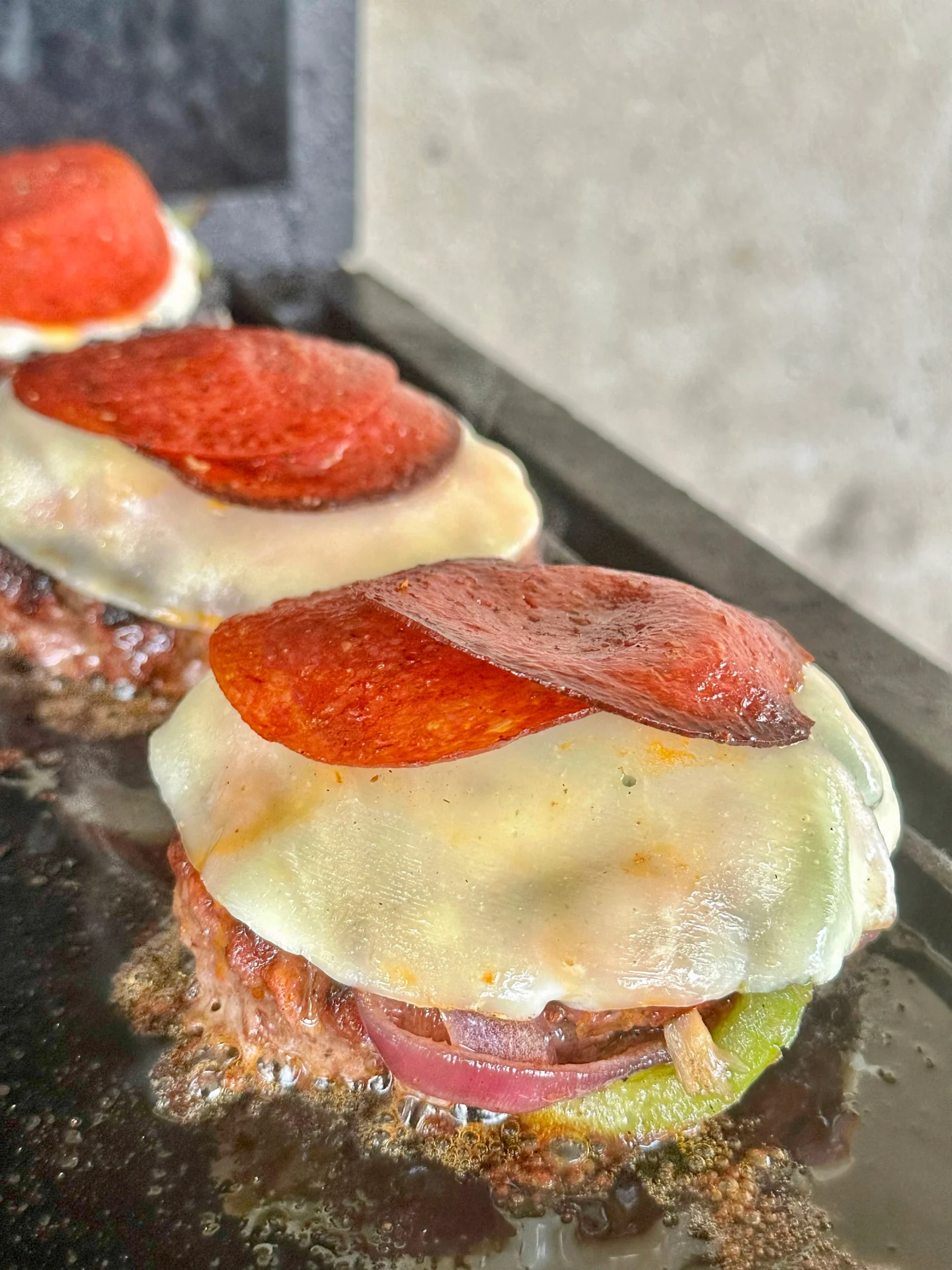 pizza burger being assembled