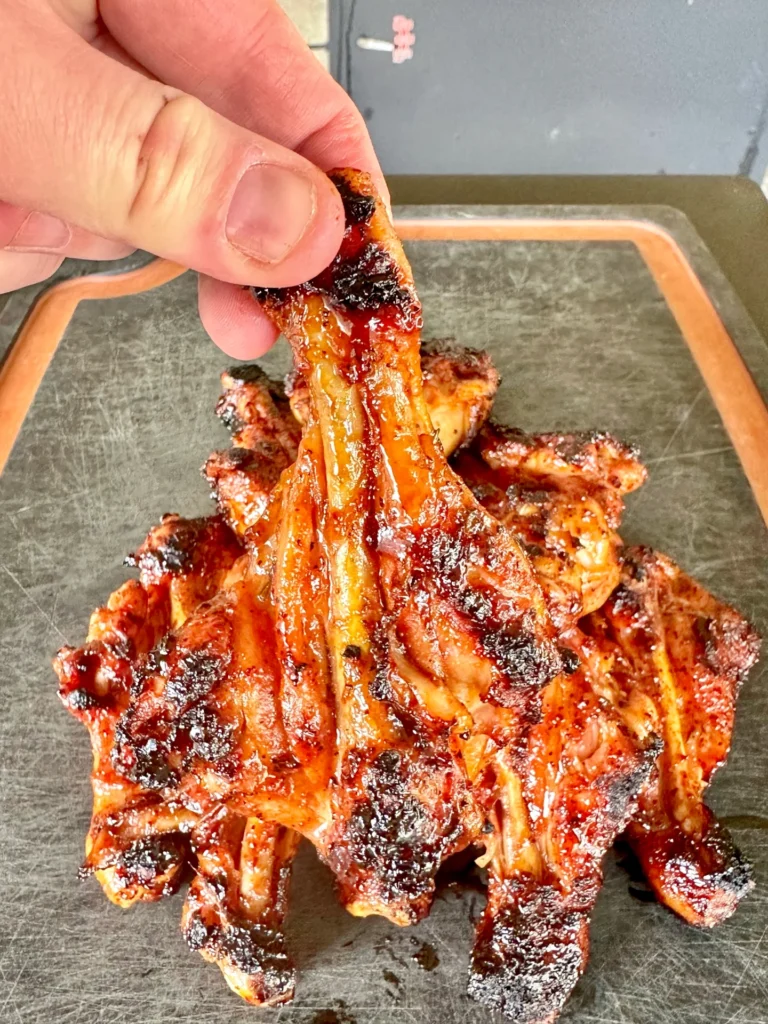 smoked chicken drum legs on a cutting board