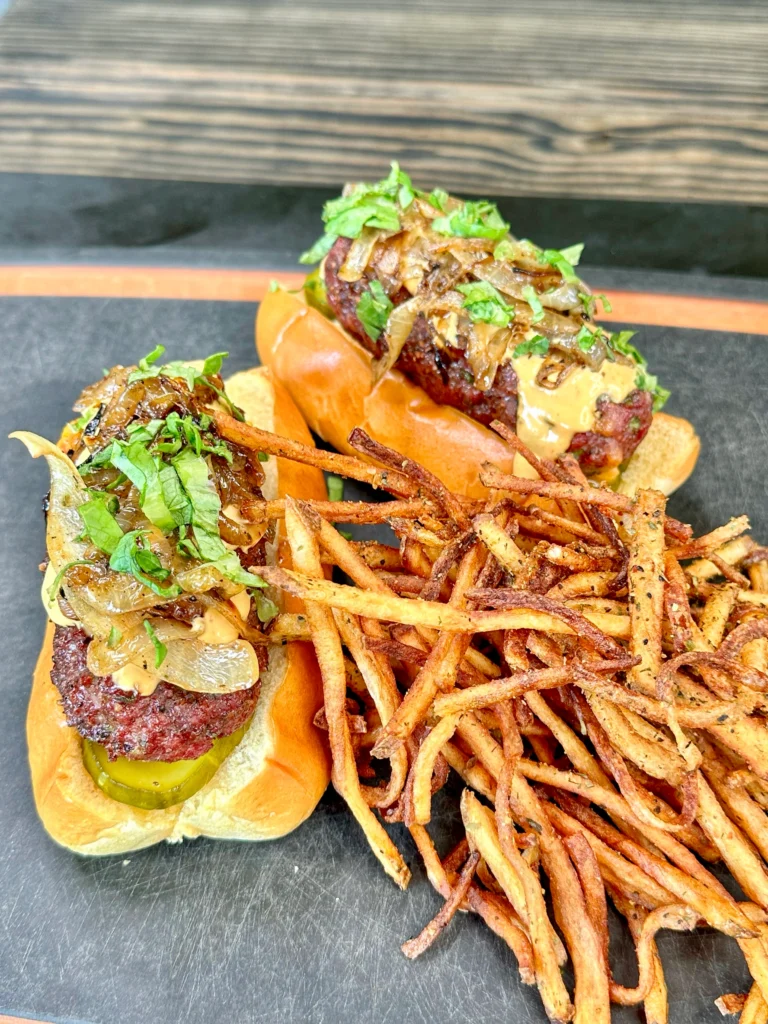 burgers dogs on a cutting board