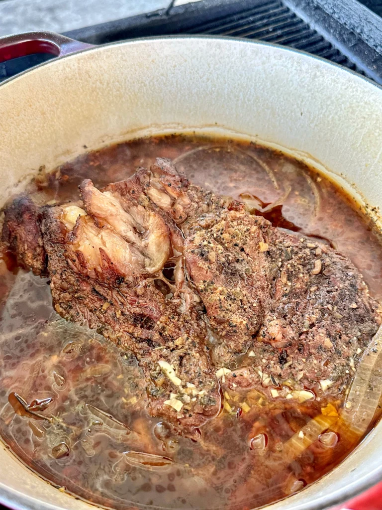 cooking the chuck roast in a dutch oven
