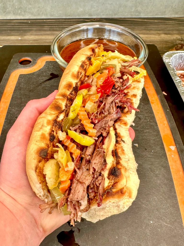 holding the italian beef sandwich