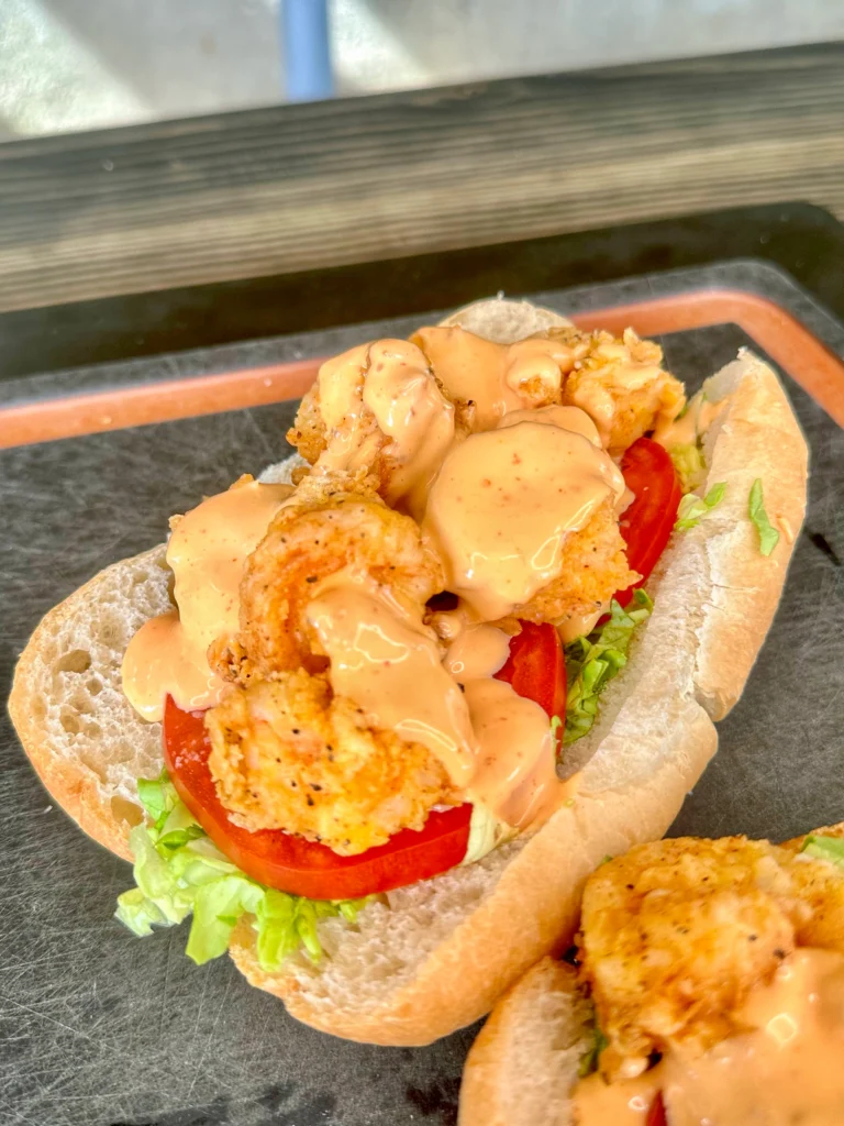 shrimp po boy on a cutting board