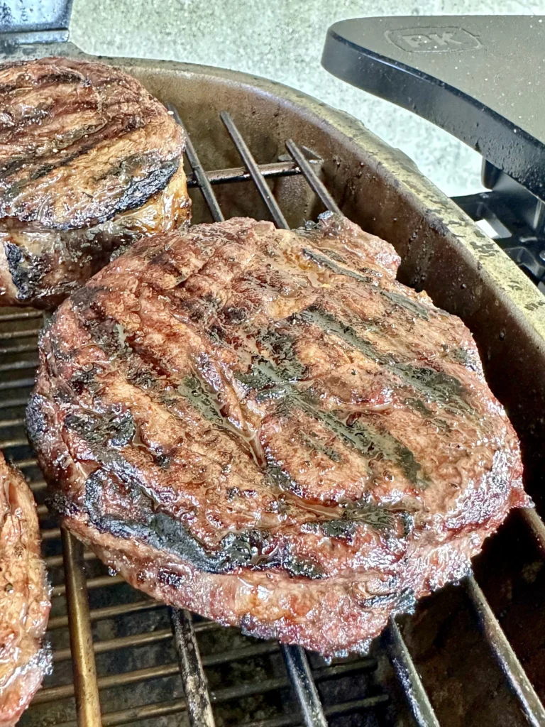 smoked steaks on the grill