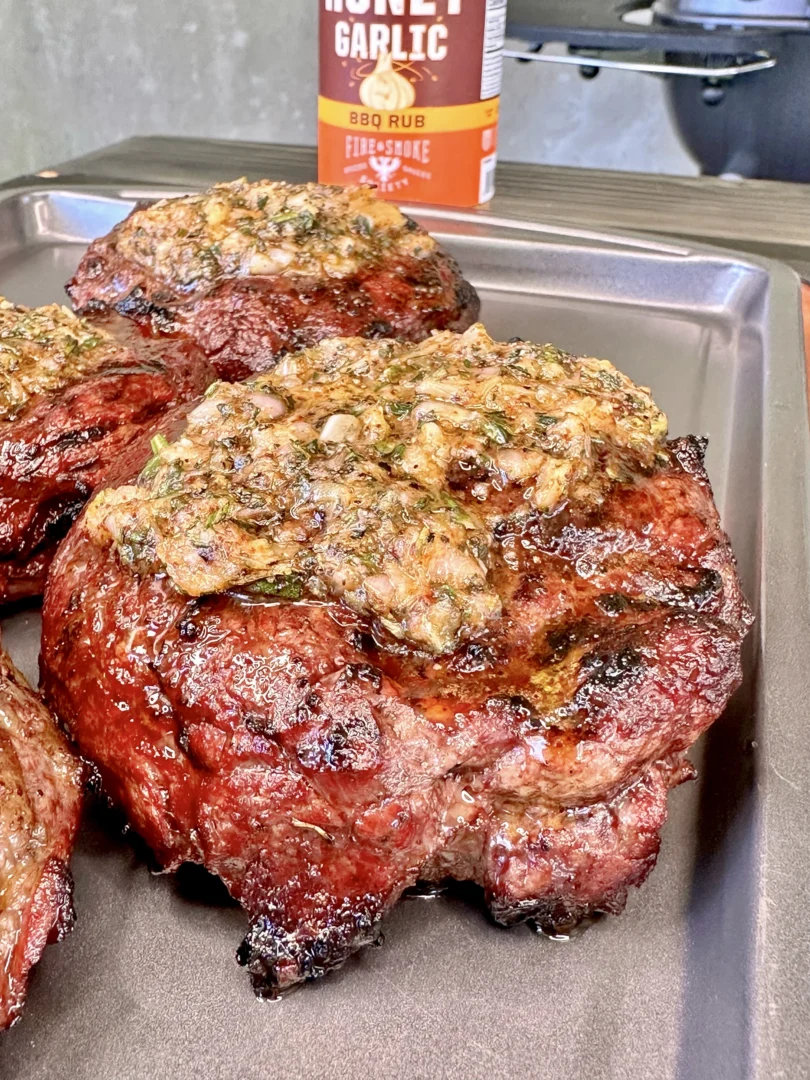 garlic butter ribeye on a resting tray