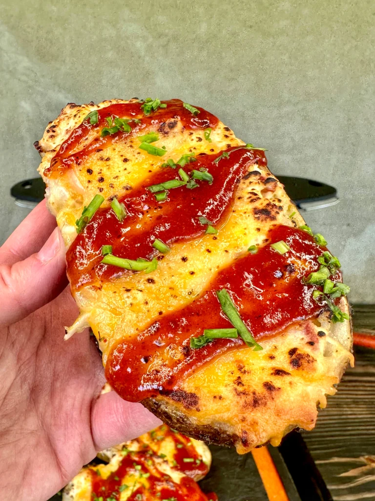 stuffed potato skins being held