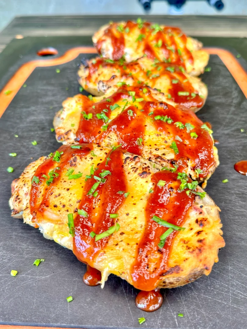 Jalapeno Popper Chicken Stuffed Potato Skins on a cutting board