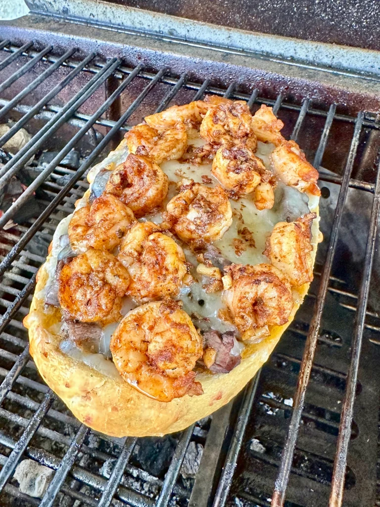 surf n turf stuffed bread on a grill grate