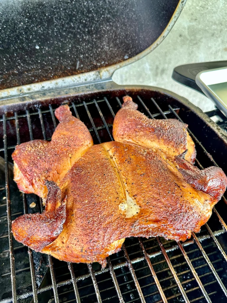 smoked chicken on for a chicken bacon ranch club sandwich on grill grates
