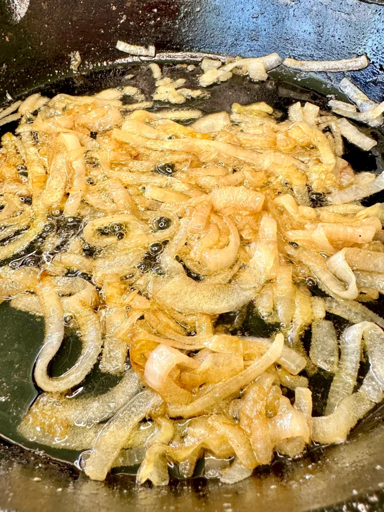 camelizing onions in a cast iron skillet