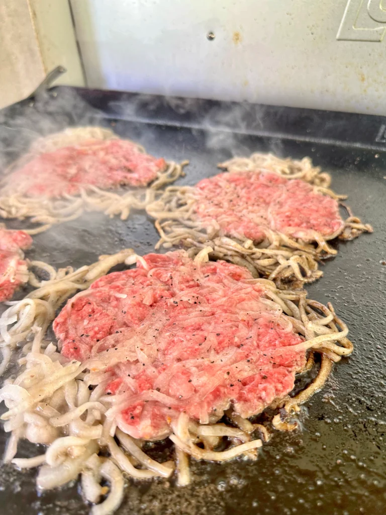 smash burgers on the grill