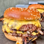 smash burgers on a cutting board