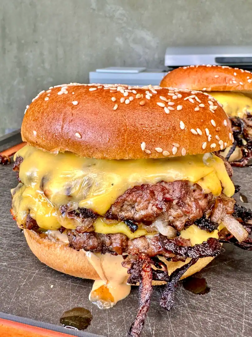 smash burgers on a cutting board