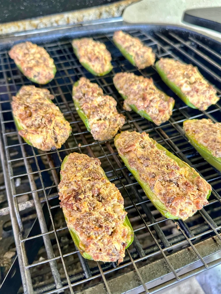 jalapeno poppers on a grill grate 