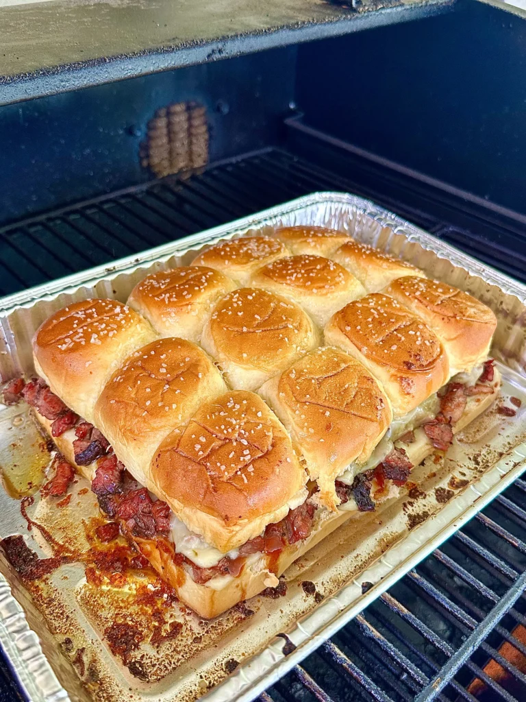 smoked sliders in a pan on the smoker