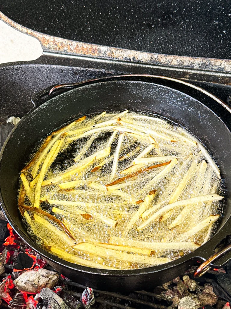 frying fries in a cast iron skillet