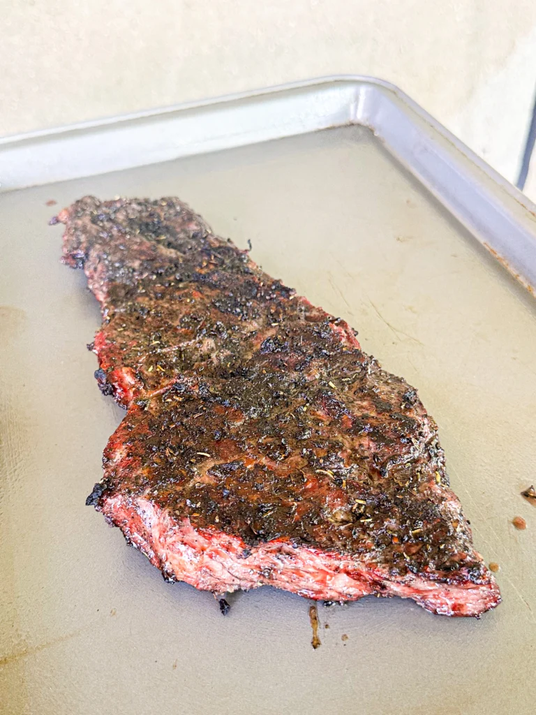 resting skirt steak for chimichurri loaded steak fries