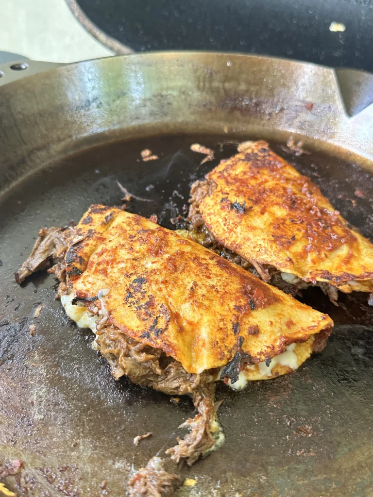 birria tacos on the cast iron