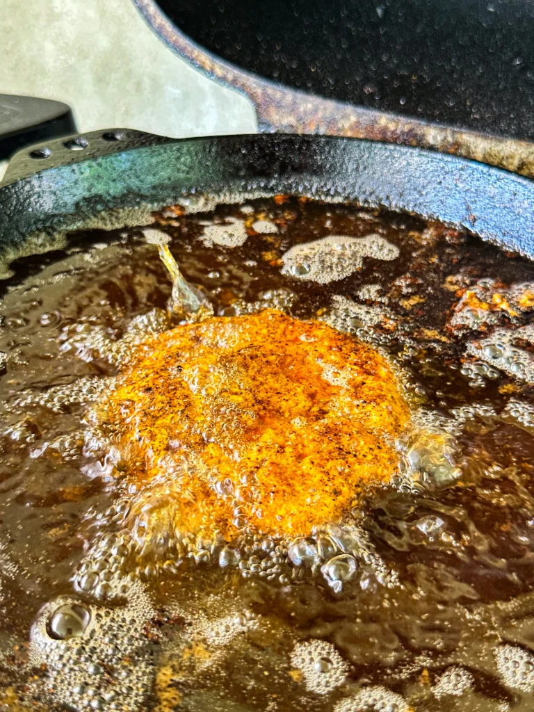 frying the shrimp patties
