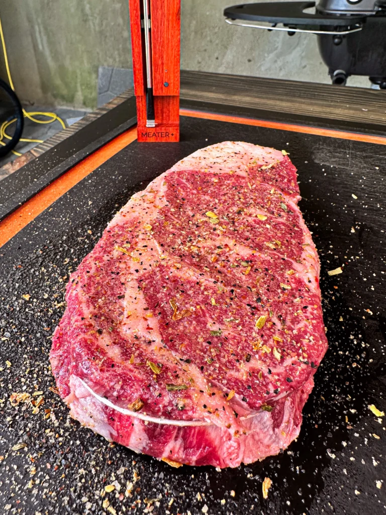 uncooked ribeye with twine around it