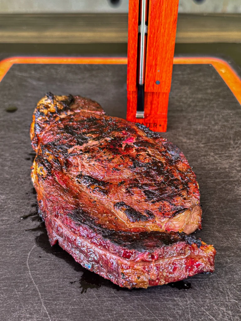 cooked steak on a cutting board