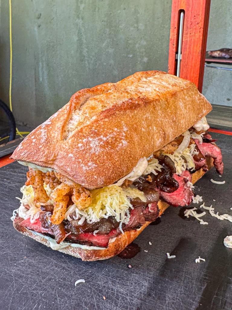 the best steak sandwich on a cutting board