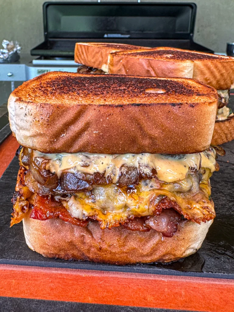 spicy patty melts on a cutting board