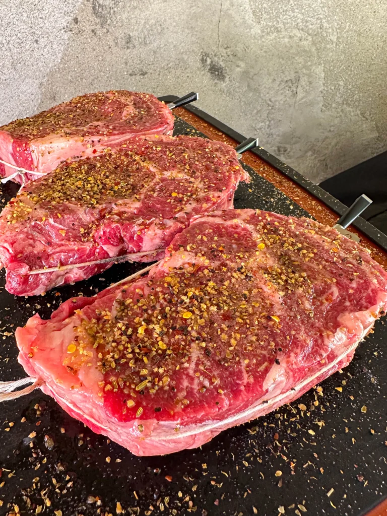 seasoned steaks with a meat probe