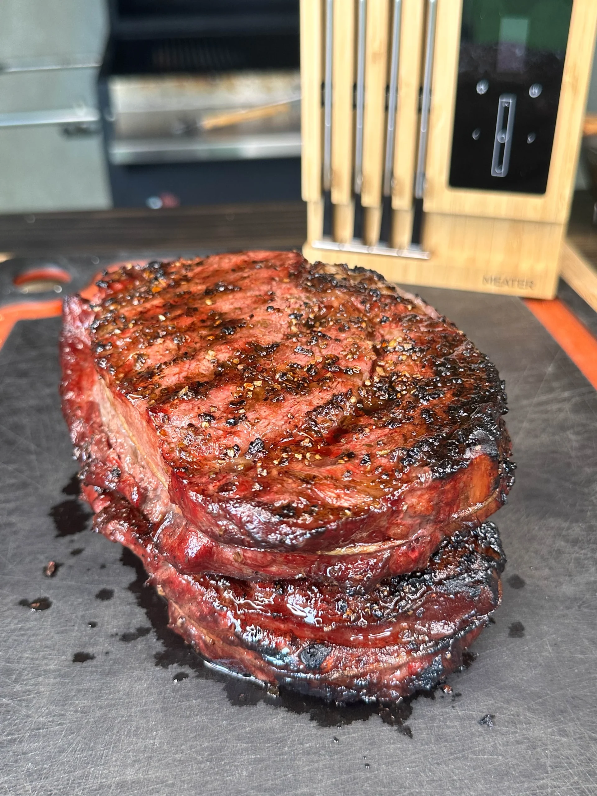 cooked steak son a cutting board
