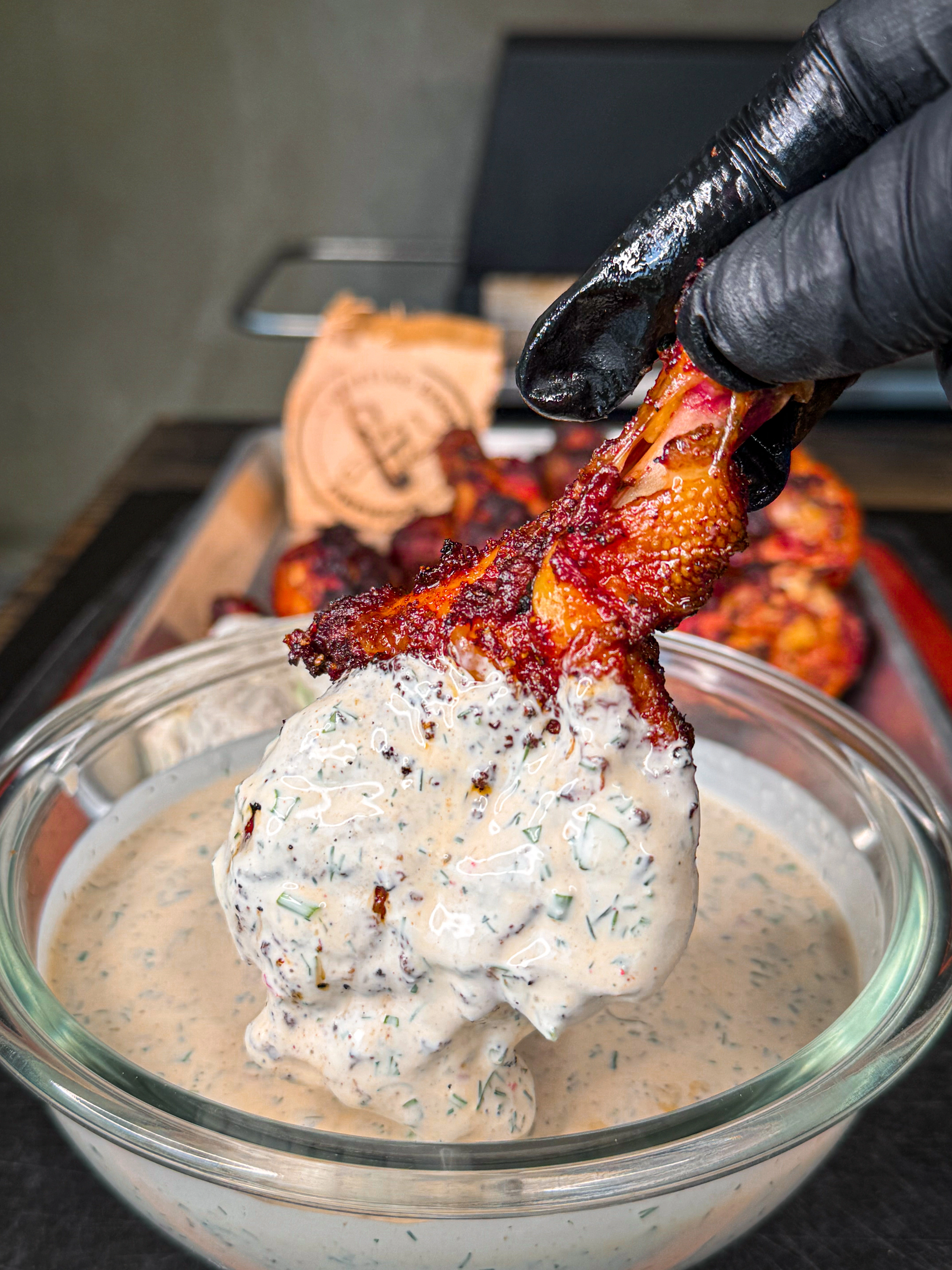 Grilled chicken legs with smoky chipotle dry rub showing crispy skin and char marks