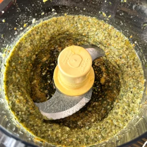 food processor with ingredients for prime rib
