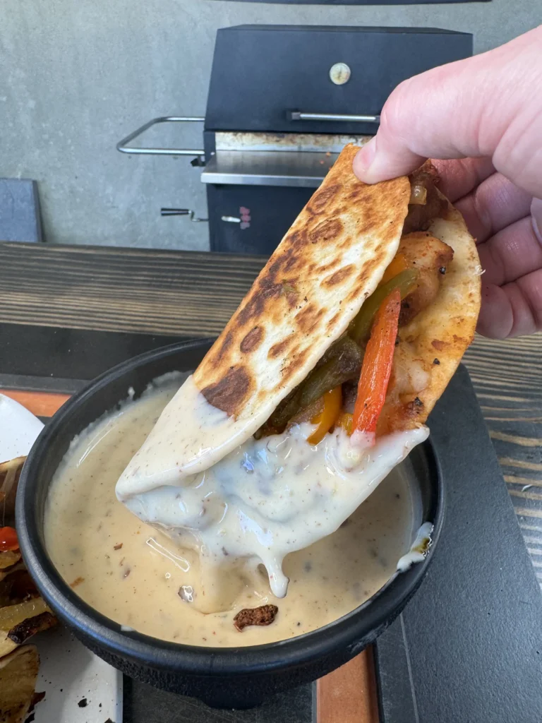 taco dipped in queso
