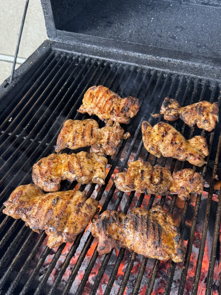 grilling the chicken on a smoker