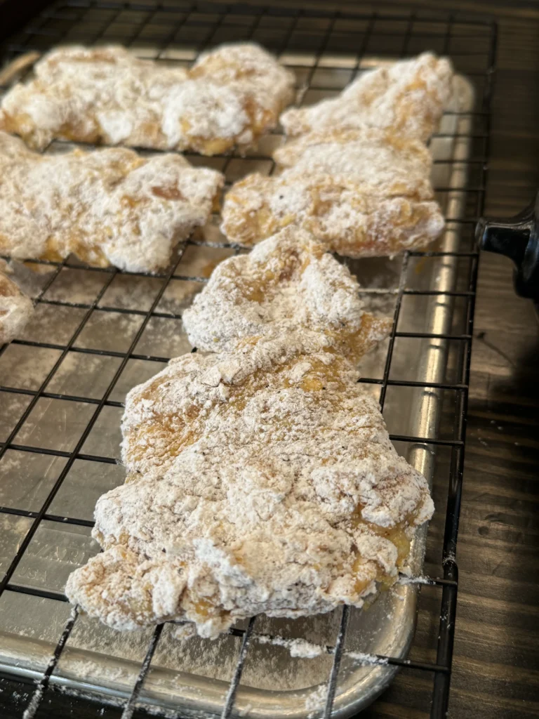 breaded chicken on a wire rack