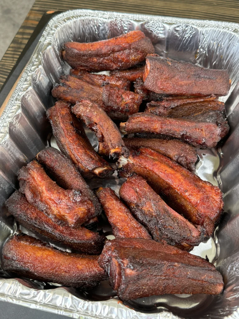 smoked party ribs in the metal pan
